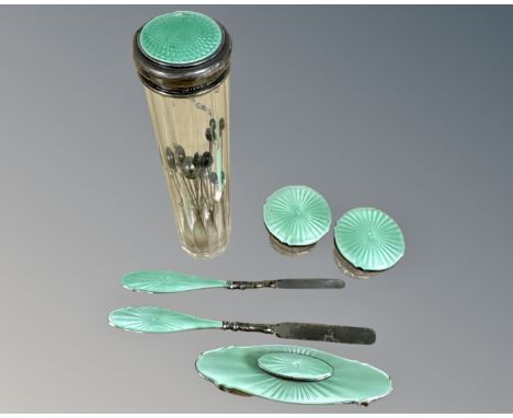 A six piece silver and green enamel dressing/manicure set.