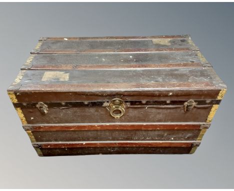 A wood and canvas travel trunk.
