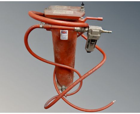 A sandblaster together with other tools including bolt cutters etc.