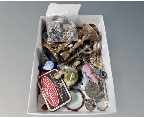 A small box containing a pair of brass candlesticks, brass compass, small painted metal rabbit inkwell (AF), fossil etc.