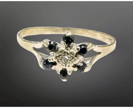 A 9ct gold sapphire and diamond cluster ring, size O. (Misshapen)  CONDITION REPORT: 0.9g