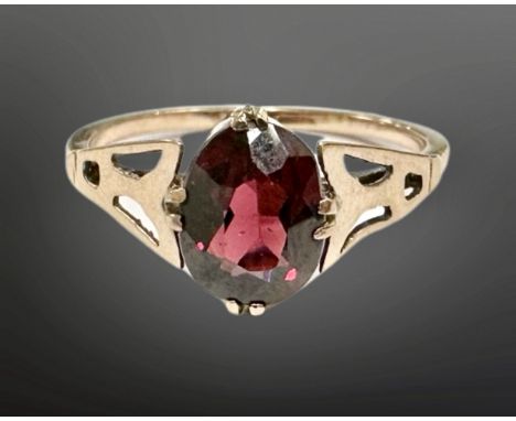 A 9ct gold single stone garnet ring, size I.  CONDITION REPORT: 1.3g