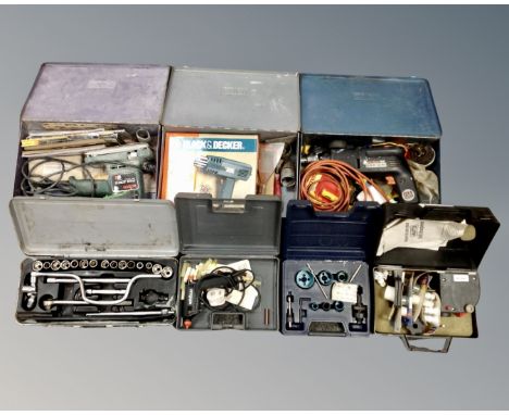 A box of boxed tools including Black &amp; Decker drill and heat gun, Bosch sander etc.