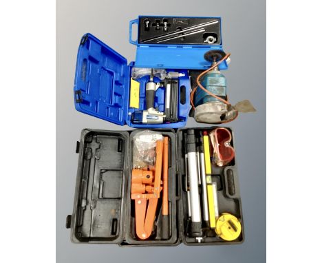 A box containing boxed and unboxed tools, Black &amp; Decker grinder, Draper air nailer etc.