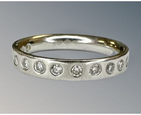 A platinum diamond half eternity ring, size H, 4.2g.