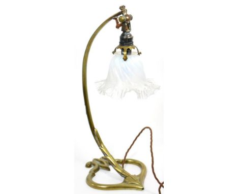 An Arts and Crafts brass table lamp in the manner of W A S Benson, with frilled glass shade