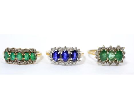 A 9 carat gold sapphire and diamond ring, finger size R; a 9 carat gold emerald and diamond ring, finger size R and a 9 carat