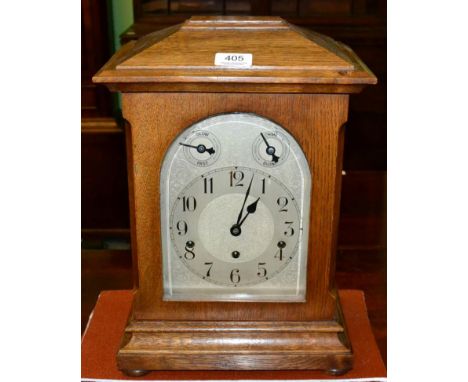 An oak chiming mantel clock 