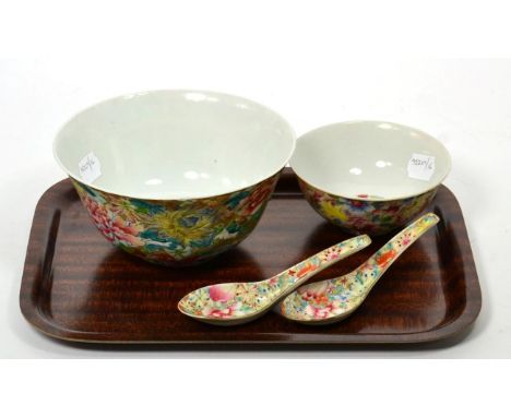 A Chinese famille rose porcelain bowl with millefleurs decoration, iron red seal mark; another smaller example and two spoons