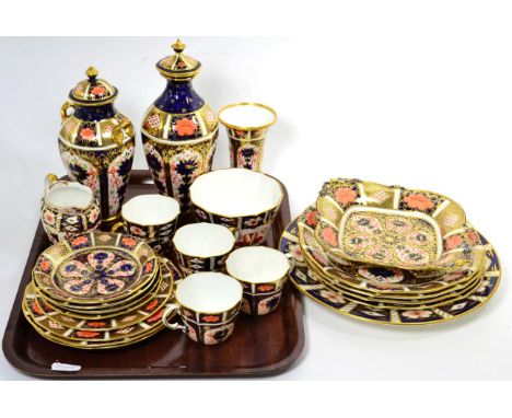 A collection of Royal Crown Derby Imari palette wares, comprising: two lidded vases, a trumpet vase, four cups and saucers, n