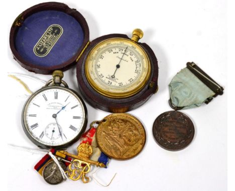 A pocket compensated barometer; a Continental 935 pocket watch; a South Africa miniature medal; and two other medals 