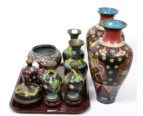 A selection of cloisonne items consisting of a large pair of vases; three pairs of vases; a bowl and cover; a small bowl; a m