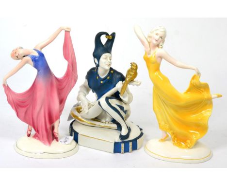 A Katzhutte (Thuringia) Figure, modelled as a seated Pierrot playing a mandolin, printed mark and impressed 27, 20cm; and two