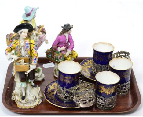 Three 19th century Continental figures; four Coalport cups and two saucers; and six silver holders 