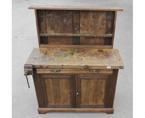 A "Gentleman's Compactum" tool bench by Marples 42" x 20" x 32" with lift up back,drawer, cupboard and vice to front and 3 dr
