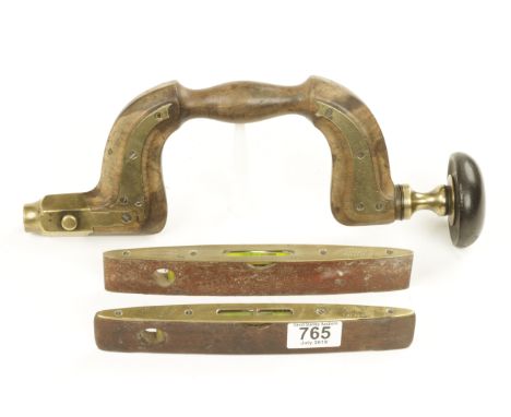 A brass plated button pad beech brace by E.WALTER Sheffield plates lifting (G-) and two brass topped boat levels by RABONE G+
