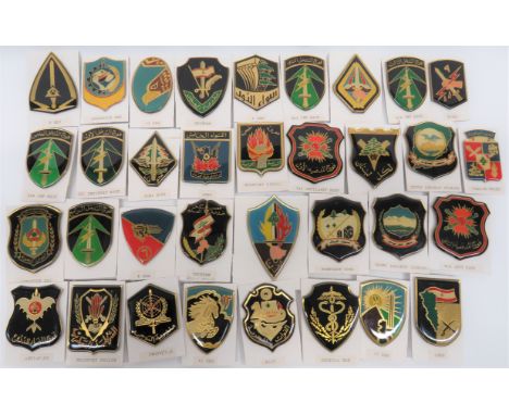 Good Selection of Lebanese Army Badges 1st pattern examples in plastic enamel shields with rear pin fixing including Northern