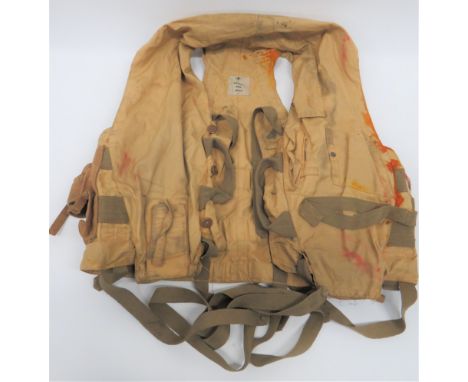 1941 Pattern RAF Mae West yellow drill material vest. Tan canvas light pocket to the right side. Mirror pocket to left chest.