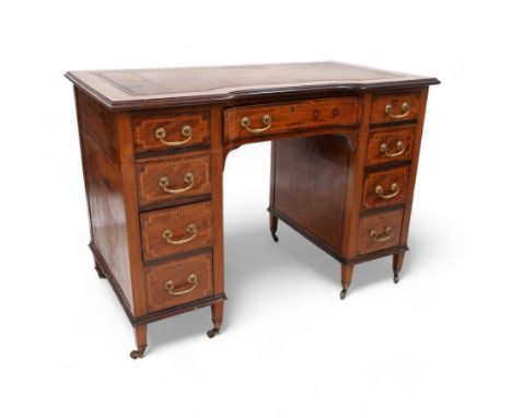 Edwardian inlaid mahogany reverse break bowfront desk, moulded satinwood banded top with inset leather writing surface, fitte