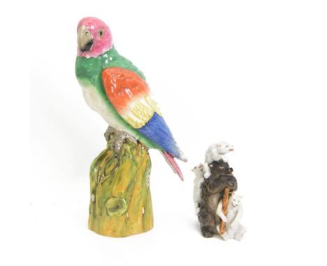 Porcelain model of a bear and cubs, possibly Russian, bearing Gardener marks beneath, and a large pottery model of a parrot, 