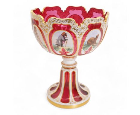 Late 19th century Bohemian white overlaid cranberry glass pedestal bowl, with fancy scalloped rim and cut with oval and fleur