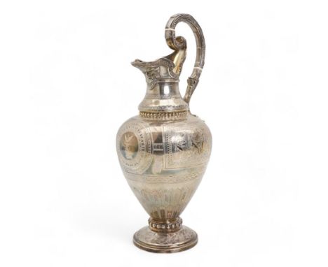 Victorian silver claret jug of baluster form engraved with Greek dithyramb panels in honour of  Dionysus, the spout with the 