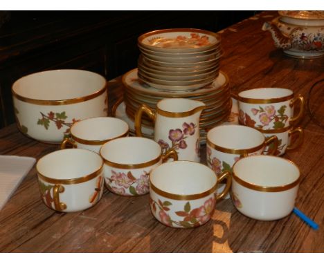 A Royal Worcester part tea service, to include tea cups and saucers, side plates, a bowl and milk jug, having a gilt edge and