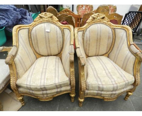 A pair of Transitional style carved giltwood salon chairs, wirth tapestry woven floral silk upholstery.
