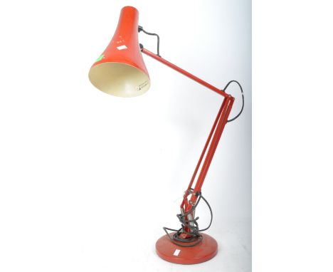 A vintage retro 20th century red Anglepoise&nbsp; Model 90 table desk lamp having conical shade over articulated arm on a cir
