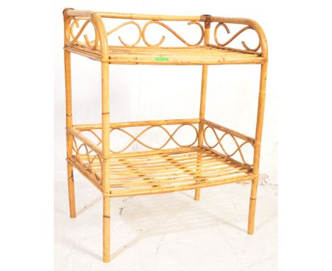 A retro vintage mid 20th Century bamboo shelved cabinet. With an arched top, wicked woven body, with four shelves on square f