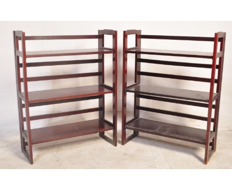 A pair of retro vintage mid 20th century teak open faced shelves having a raised gallery back with pierced sides. Folds away 
