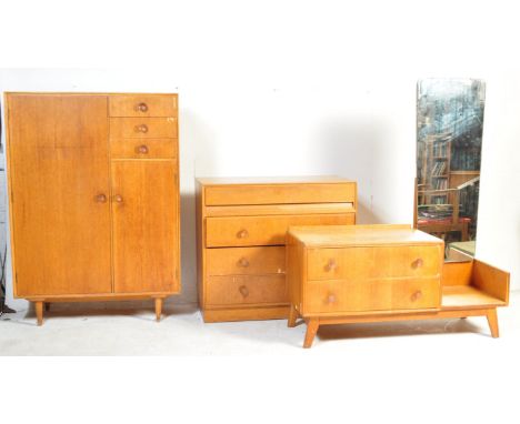 Meredew - A vintage retro mid 20th century oak veneer retro Meredew furniture bedroom suite comprising of drop centre dressin