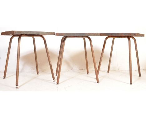 A set of three vintage mid 20th century oak topped cafe tables, having oak panel tops over metal tubular supports. Measures 7