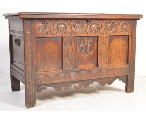 A George III late 18th century carved oak coffer trunk having later Victorian 19th century intricate carved foliate decoratio