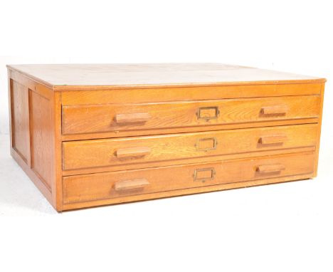 A vintage retro mid 20th century teak architects plans chest / coffee table. The table having a bank of three long drawers, e