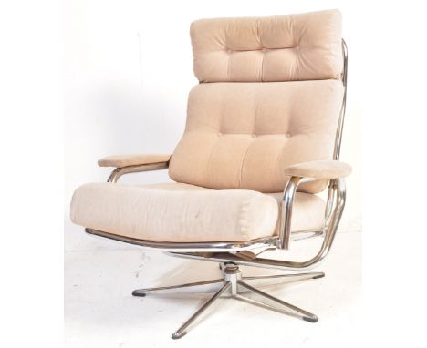A retro vintage 20th century circa 1970s chrome &amp; fabric swivel armchair having removable cream colour cushions over a ch