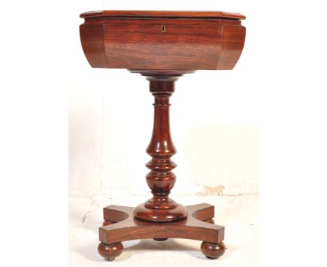 A 19th Century Rosewood teapoy / tea caddy on stand of octagonal form comprising of a hinged lid top tea caddy section openin