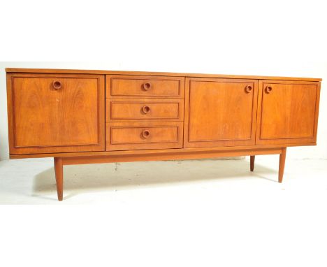 A retro vintage mid 20th century teak wood Austinsuite sideboard / high board / credenza having a straight top over a lateral