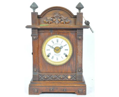Fattorini &amp; Sons - An early 20th century mantel clock having a white enamelled face with roman numeral to the chapter rin