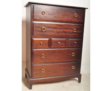 A retro vintage mid 20th century Stag Minstrel tallboy chest of drawers having a flared top over a bank of drawers with brass