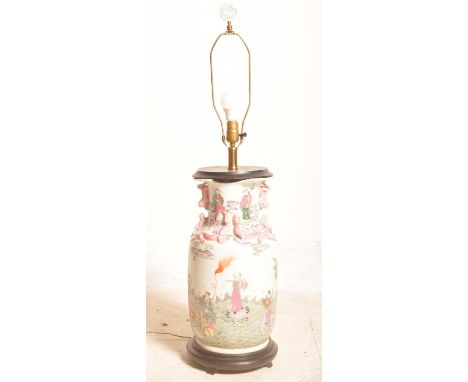 A vintage 20th century Chinese Oriental famille rose ceramic vase of ovoid form having dragon embellishments &amp; rural scen