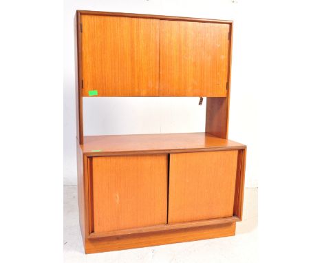 A retro vintage mid 20th century G-Plan teak furniture. The lot to include a wall unit / credenza / high board. The sideboard