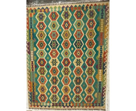 An early 20th century Turkish Islamic Anatolian Kilim&nbsp; floor carpet rug having a repeating polychrome hexagonal patterns