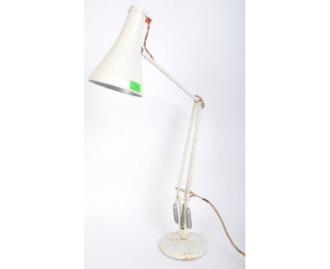 A retro vintage 20th Century white enamel Herbert Terry angle poise lamp. Of typical form with a circular base, with makers m