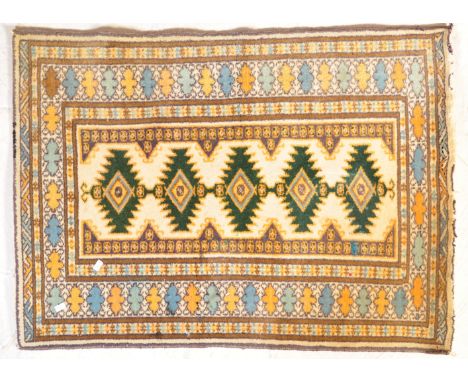 A 20th century Turkish Kilim type rug carpet having geometric harshang type motifs to centre with repeated geometric borders.