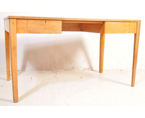 A vintage 20th century oak wood pack away writing studio desk having a straight top with green leather centre over a fitted f