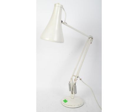 A vintage retro mid 20th century Herbert Terry anglepoise white desk lamp having conical shade over articulated arm upon a ci