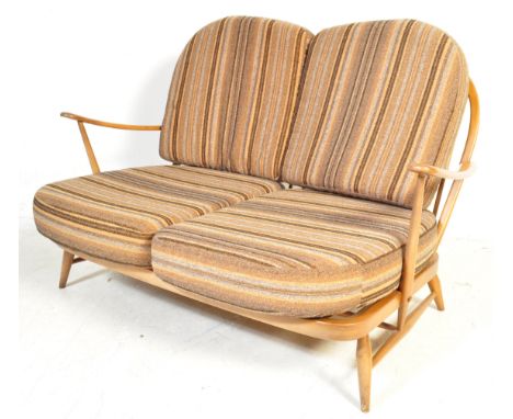 Ercol - A mid 20th century retro vintage Ercol Windsor pattern beech and elm wood sofa settee complete with the original upho