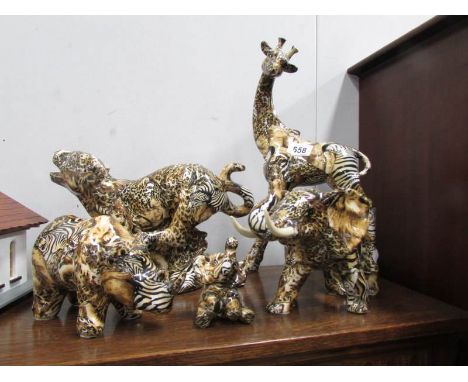 5 decoupage/collage style ceramic wild animal figurines including giraffe, cheetah, elephant etc.,