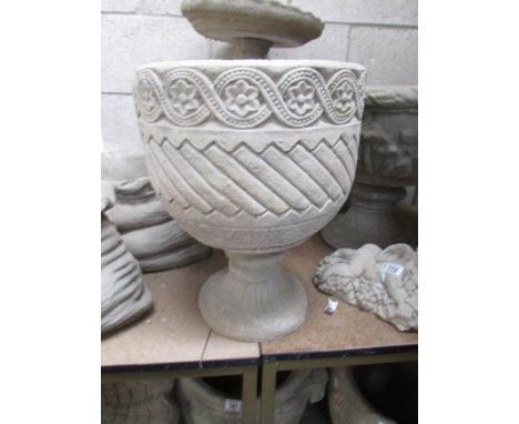 A Mayan circular urn with Aztec design.